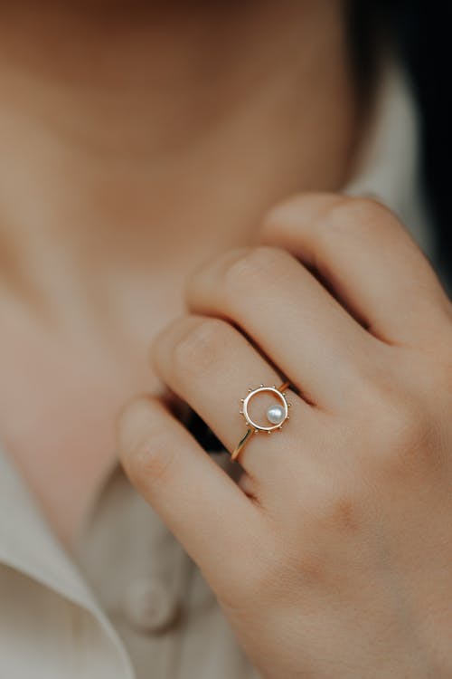 Gold Ring on Hand of Woman