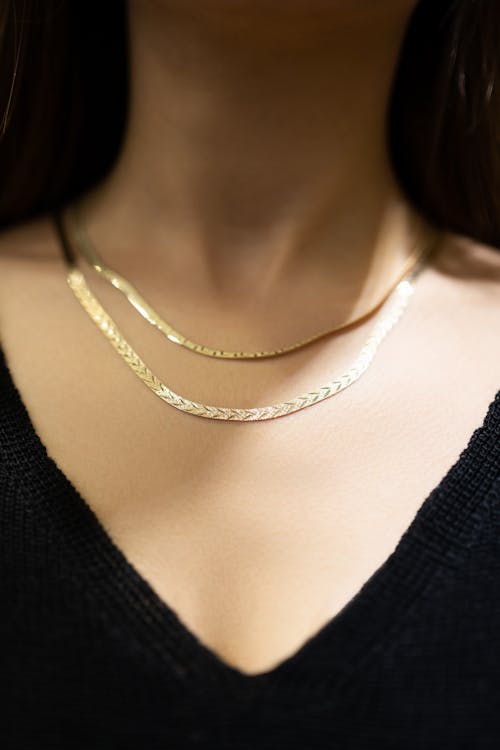 Close-up of Woman Wearing Delicate Necklaces 