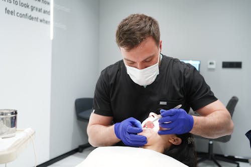 Dentist Sitting and Working