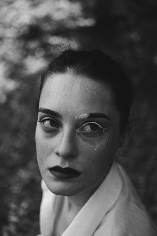 Portrait of a Pretty Brunette Wearing Face Gems