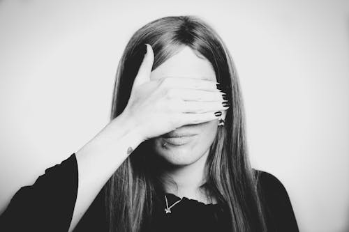 Grayscale Photo Of Woman Covering Her Eyes