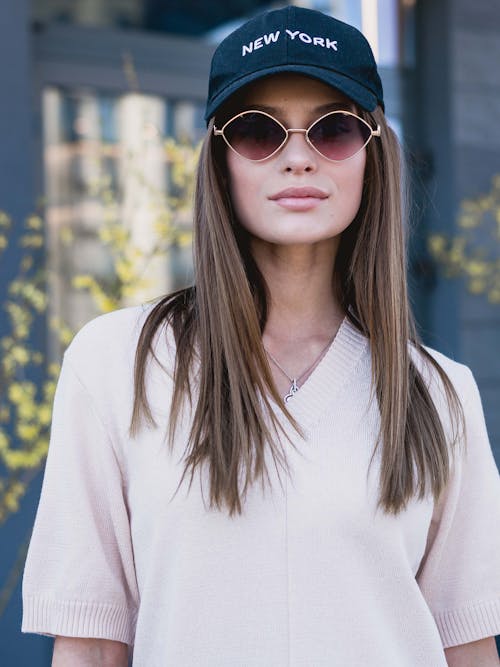 Woman in Cap and Sunglasses
