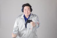 Man in Headphones and with Controller