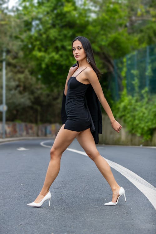 Woman in Black Sequin Dress and High Heels