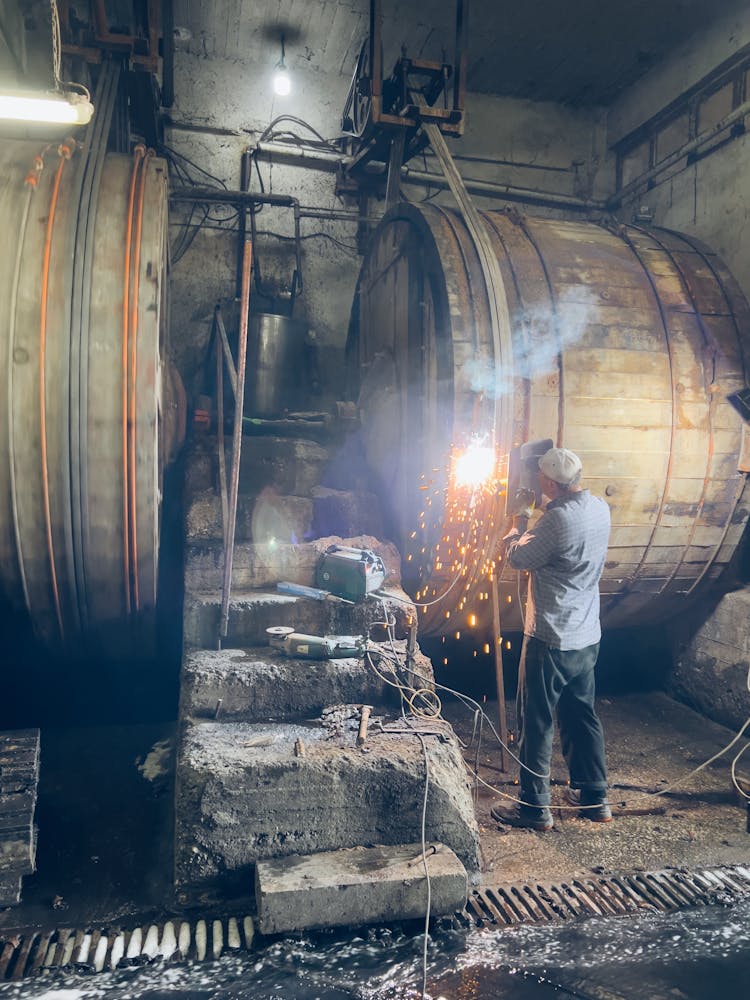 Man Welding In Factory