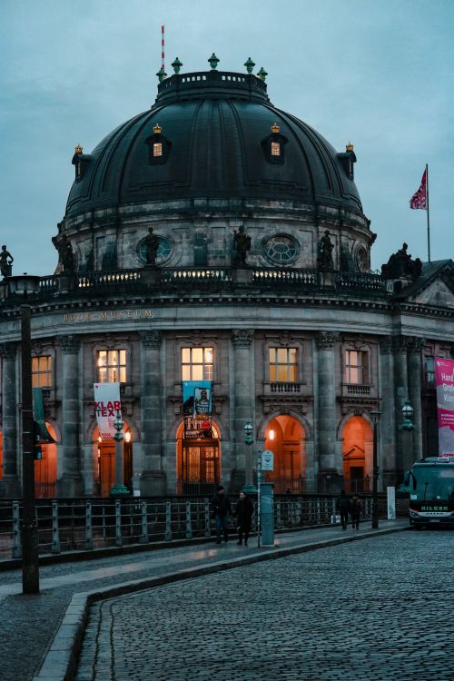 Free The ornate dome of Bode Museum illuminated at dusk in Berlin, Germany. Stock Photo