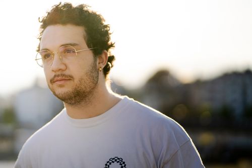 Free Portrait of a man with eyeglasses standing outdoors in Lausanne, Switzerland during sunset. Stock Photo