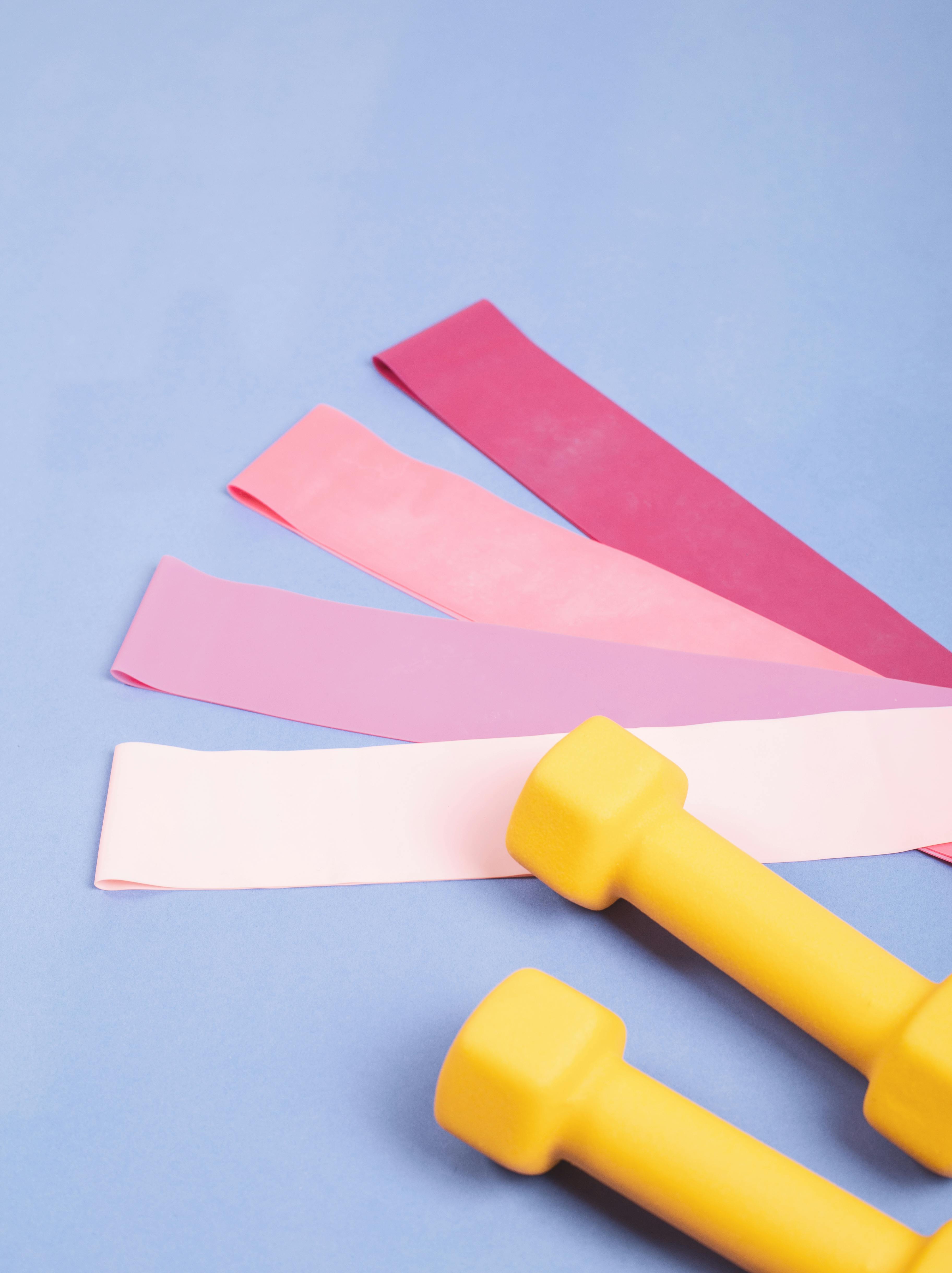 Woman smiling while training with resistance bands