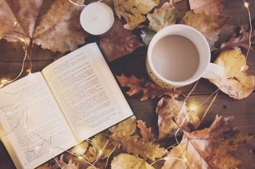 White Ceramic Mug And Book