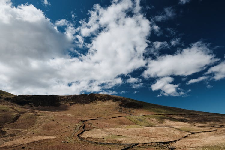 Clouds Over Sunlit Hill