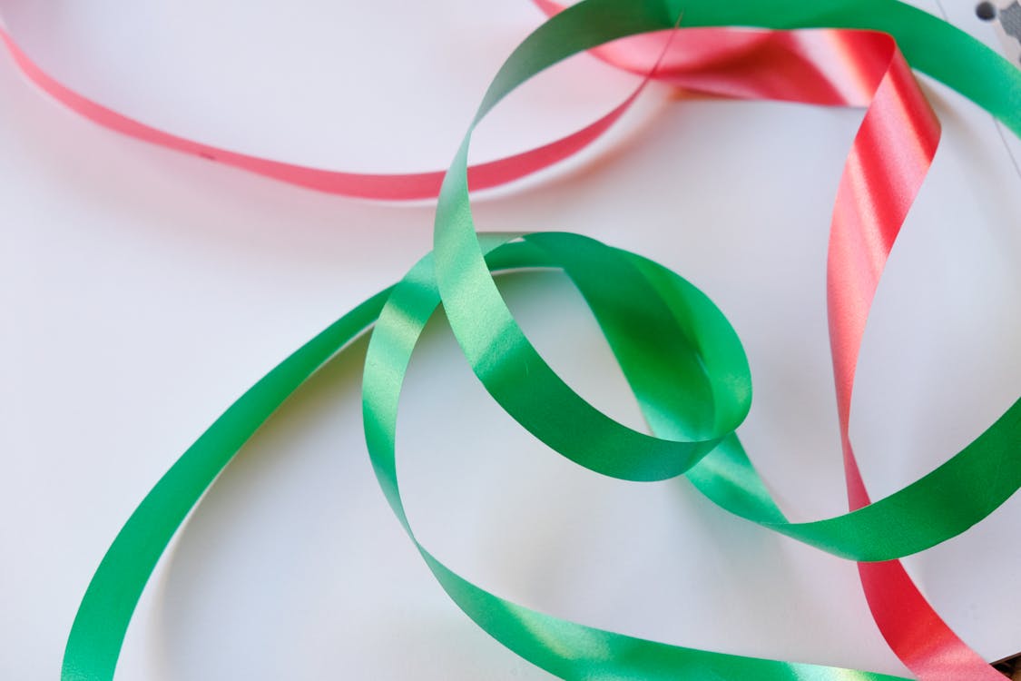 Free stock photo of background, christmas background, green ribbon