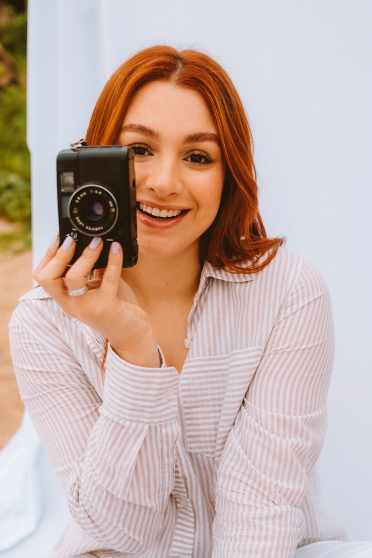 Smiling Woman With Camera