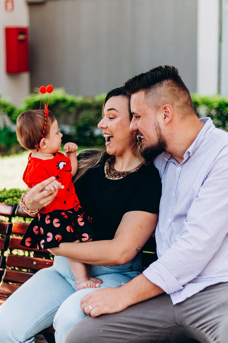 Photo Of A Happy Family With A Baby