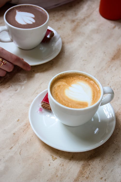 Cups of Coffee and Hot Chocolate with Foam