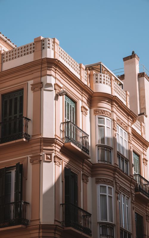 Free Capture of classic architectural building in Málaga, highlighting summer urban beauty. Stock Photo