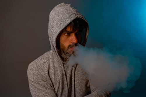 Man in Hoodie Smoking