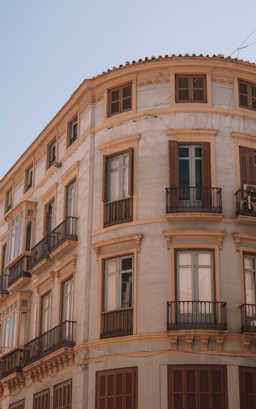 Free Beautiful facade of a historic residential building in Málaga, Spain showcasing classic architecture. Stock Photo
