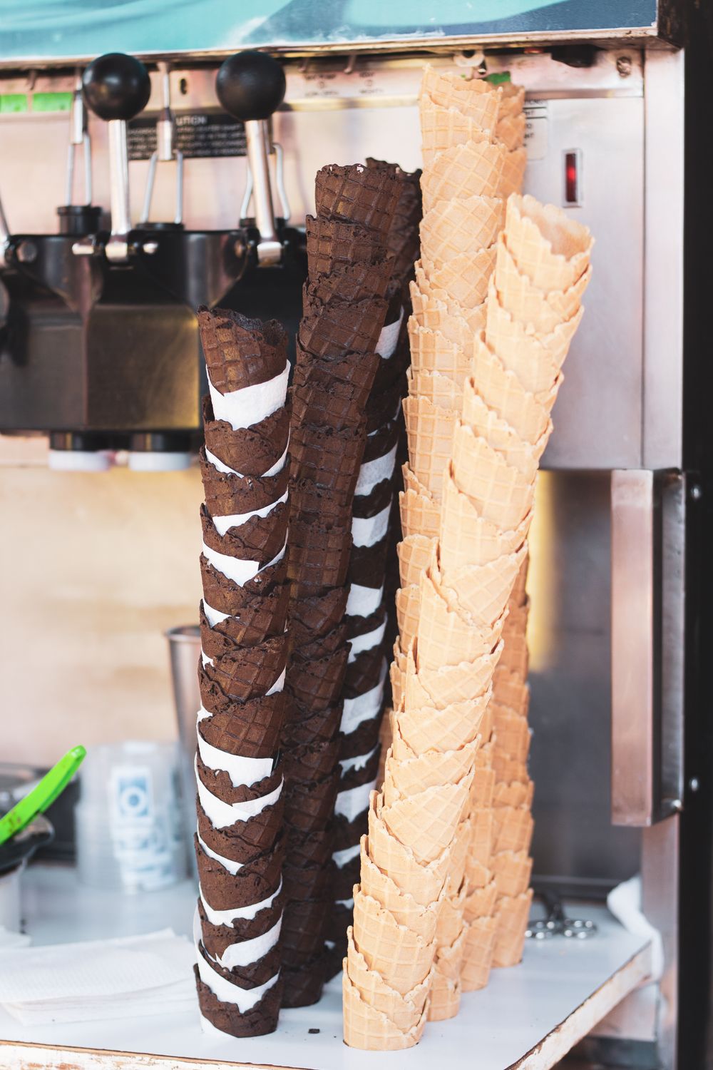 Stacks of plain and chocolate waffle cones in the production kitchen