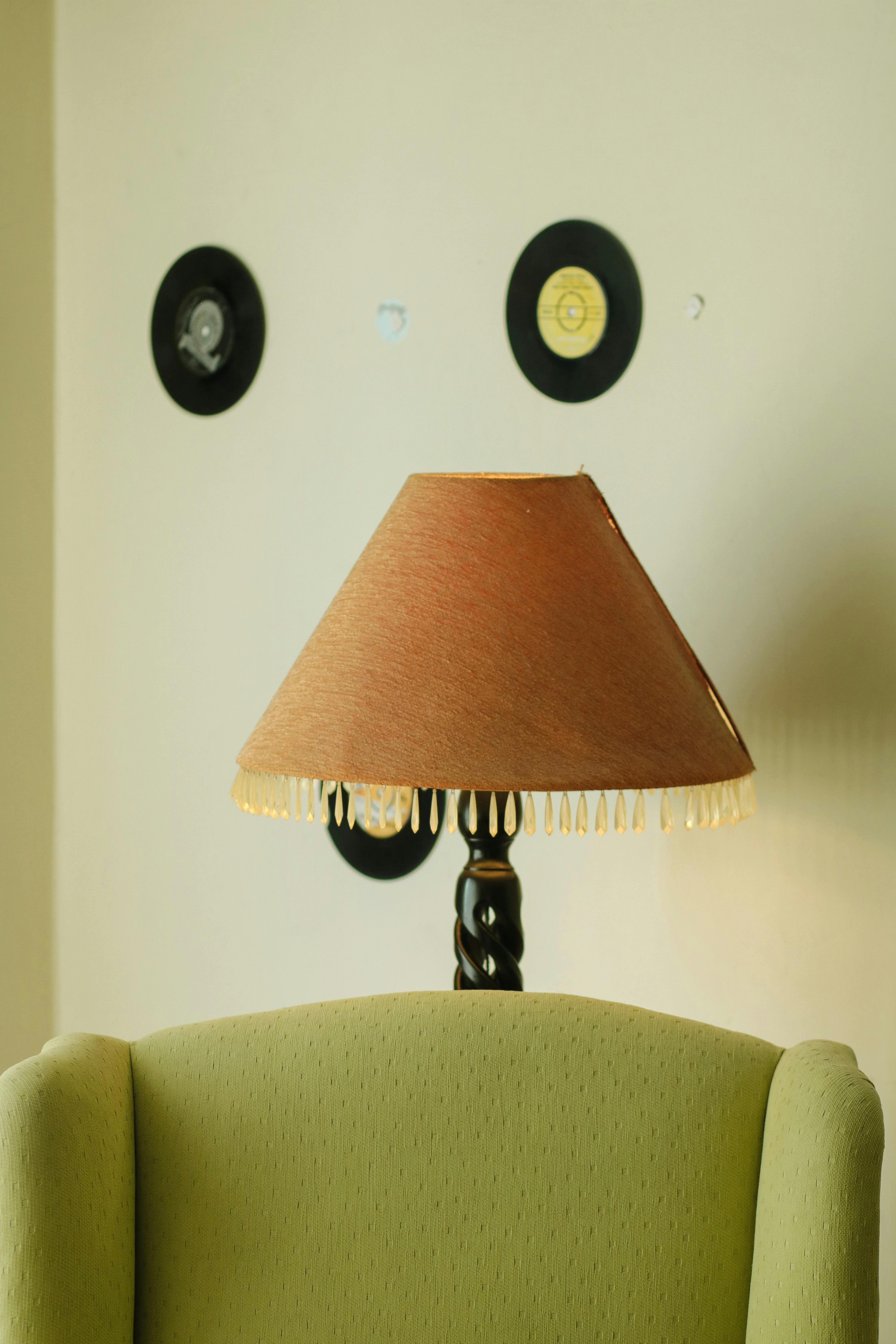Vinyl Disks on Wall over Lamp and Armchair · Free Stock Photo