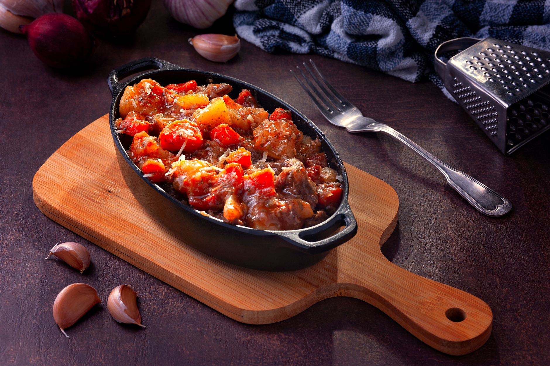 Golden crispy cast iron shallow casserole fresh from the oven