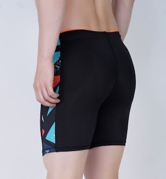Close-up back view of a person wearing fashionable black athletic shorts, showing unique geometric patterns.