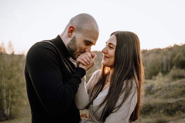 Man Kissing Woman Hands