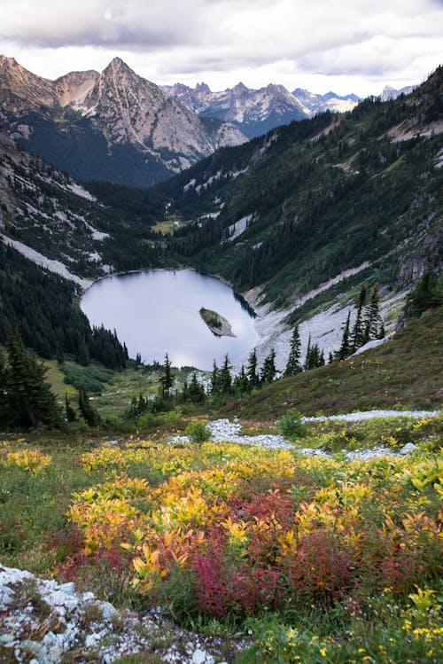 Lake Surrounded by Mountain Photography