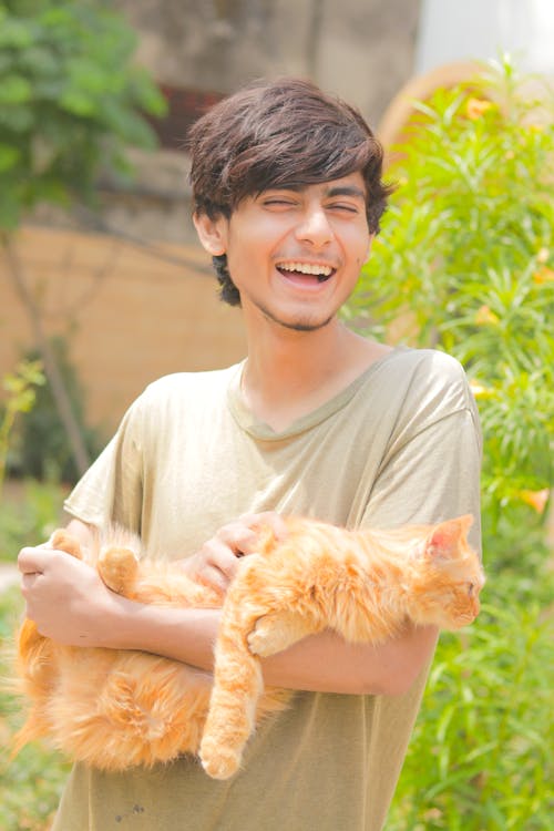 Smiling Man Holding Cat