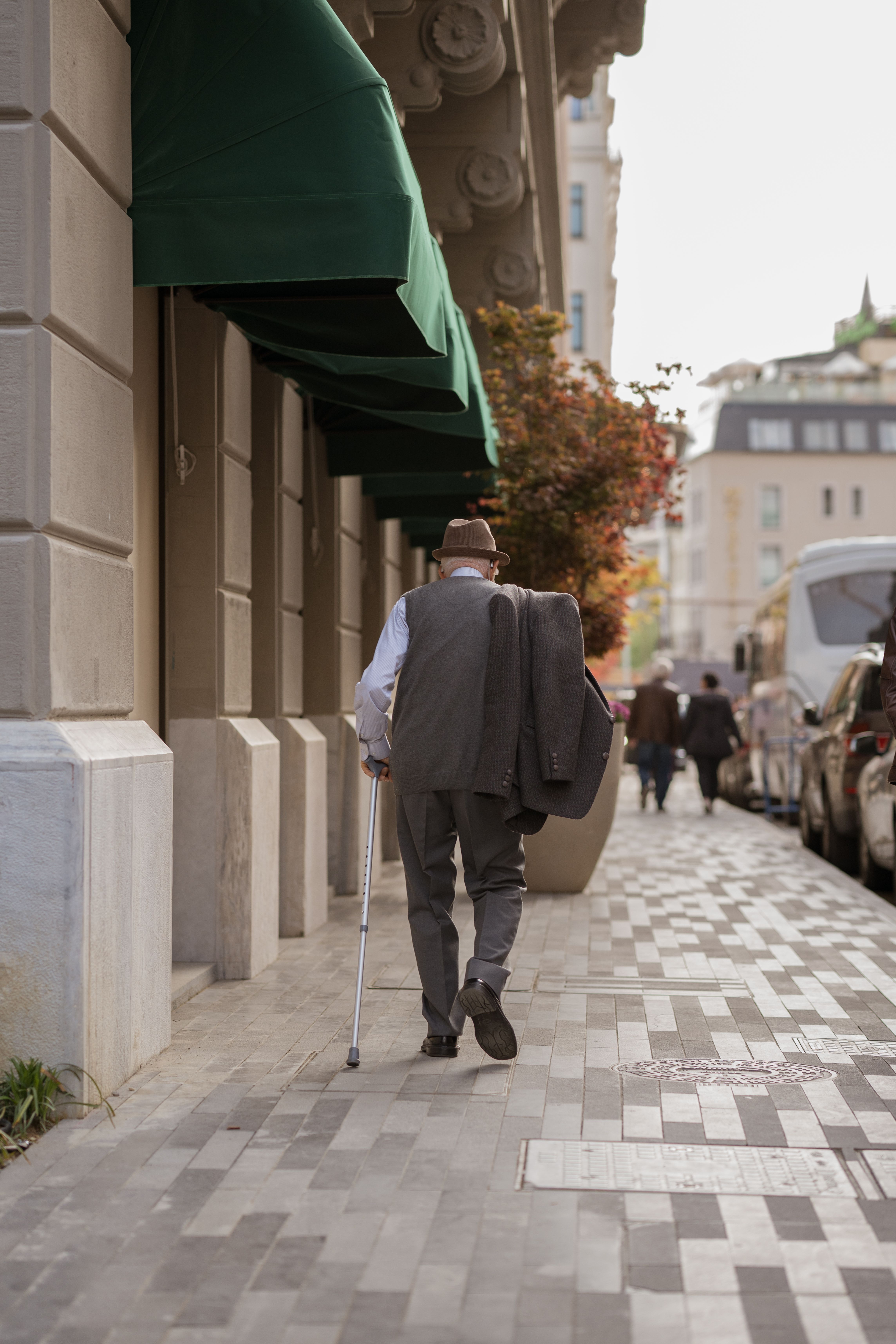 Elderly Man Walking with Walking Stick · Free Stock Photo