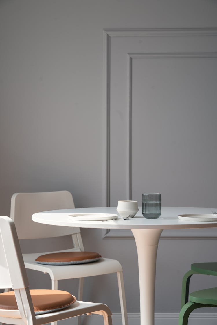 White Table, Chairs And Wall