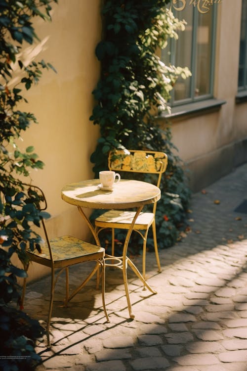Table and Chairs on Cobblestone Street