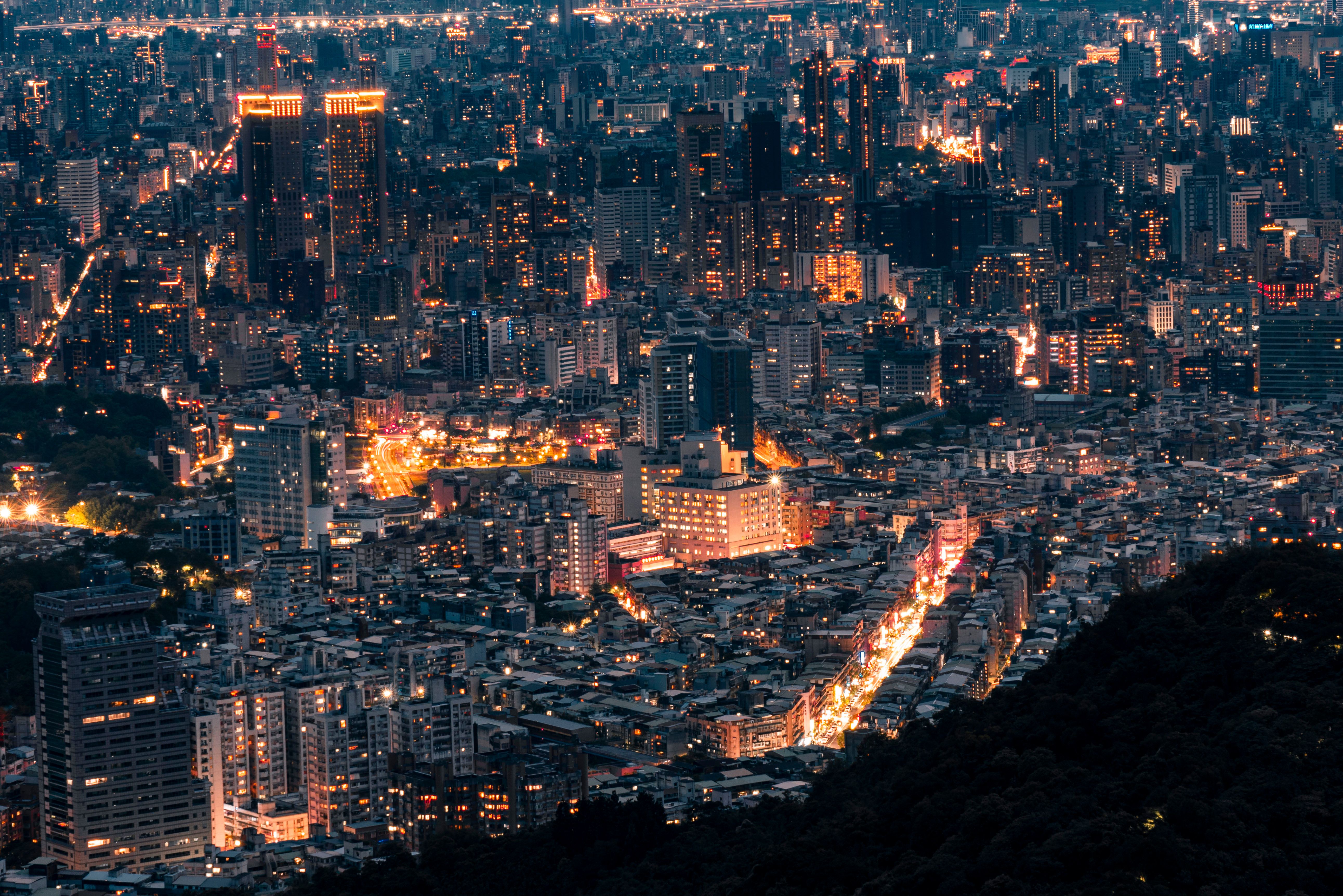 Aerial View of a Modern Illuminated City at Night · Free Stock Photo