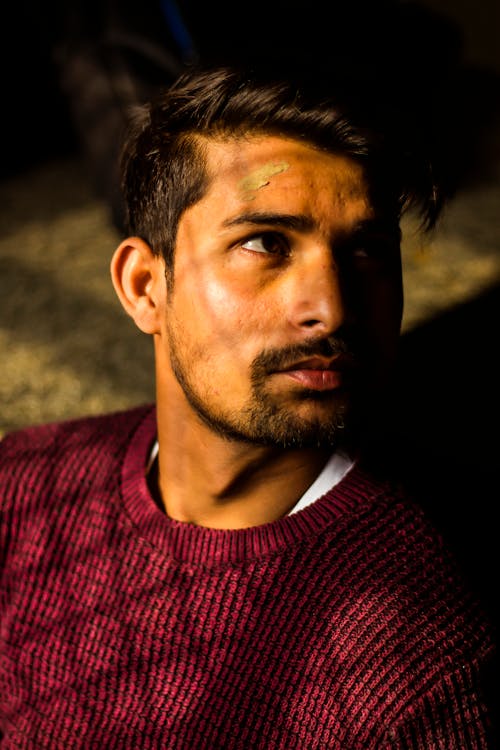 Photo of Man Wearing Maroon Sweater