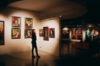 Gallery interior with hanging works — photo by Darya Sannikova on Pexels