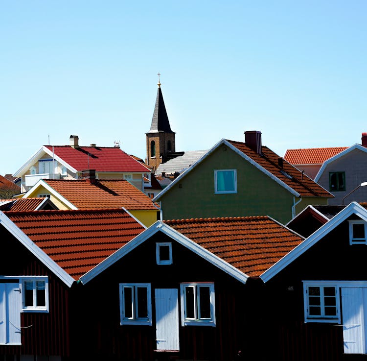 Church Tower Above Rows Of Nordic Style Houses