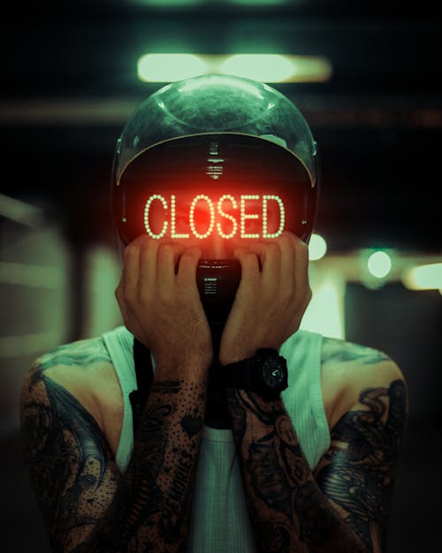 Man in Helmet with Light Lettering on Face