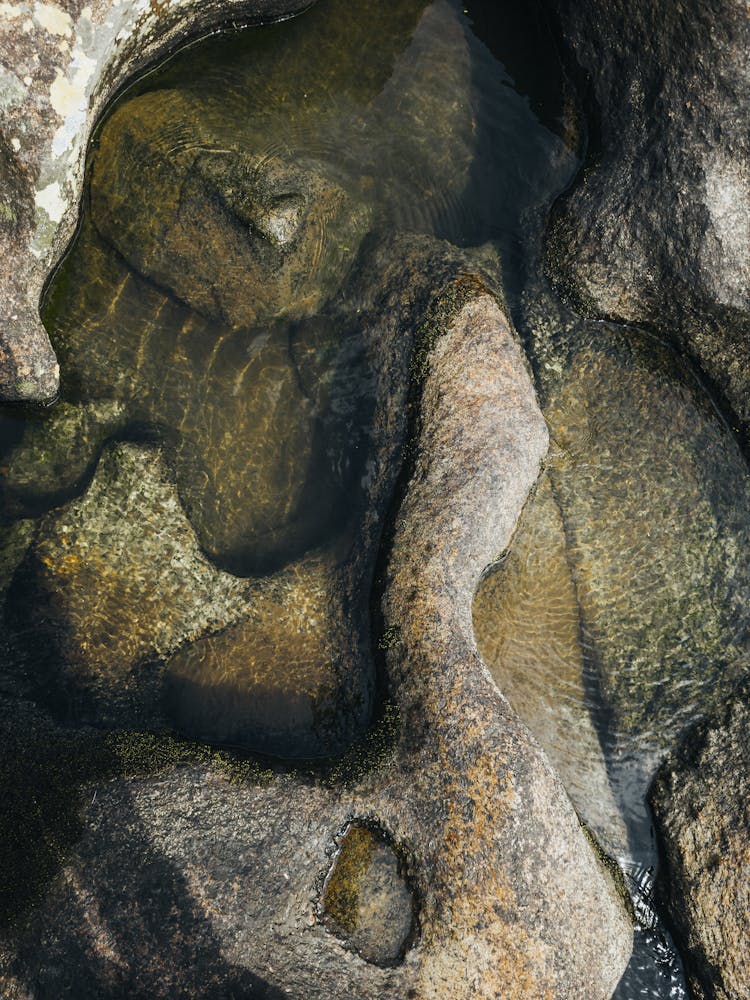 Clear Water Pooling Between Rocks