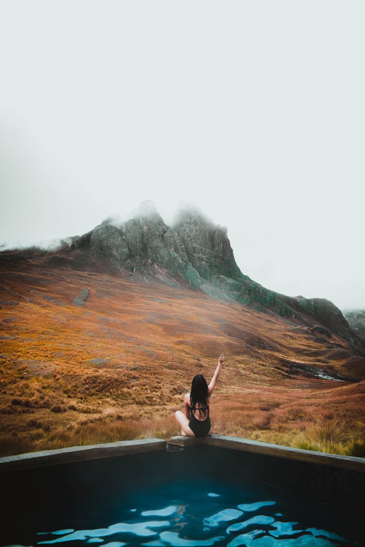 A Woman In A Pool In Mountains