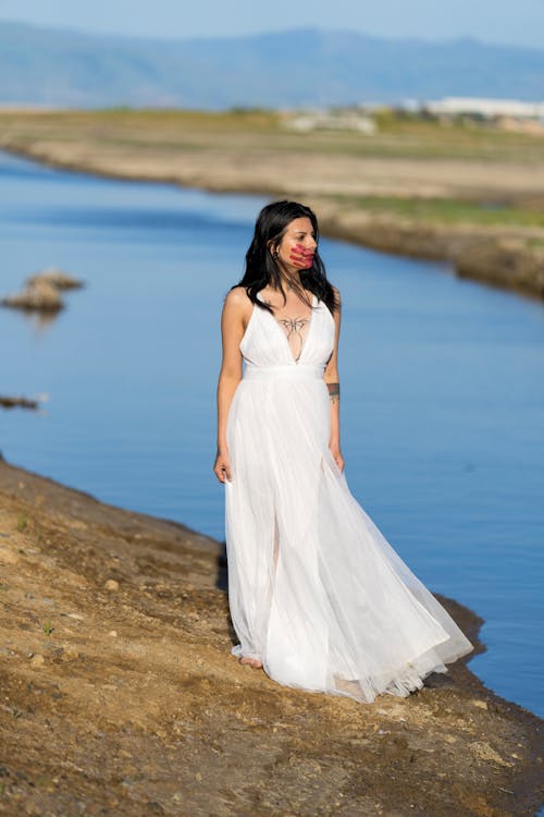 Bride with Painted Face on Riverbank