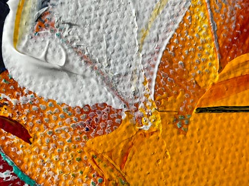 Close-up of White and Orange Paint Stains on Canvas