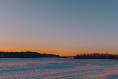 Snow-covered fields under a winter sunset — Irina Iriser on Pexels