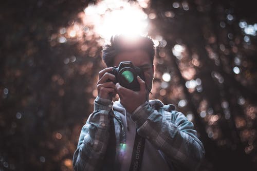 Selective Focus Photography of Man Using Dslr Camera