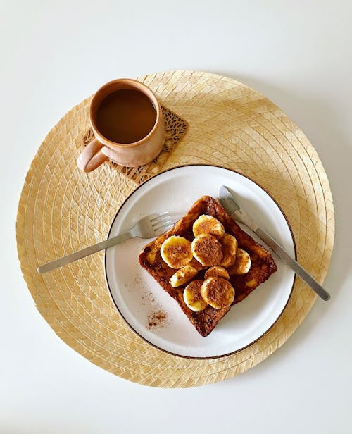 Free Photo of a Breakfast with Banana Toast and a Cup of Coffee Stock Photo