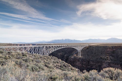 Landscape Photography of White Metal Bridge Under Blue Sky