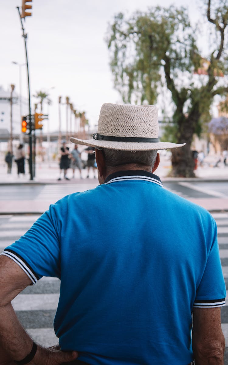 Man In Blue Polo T-shirt And Straw Hat