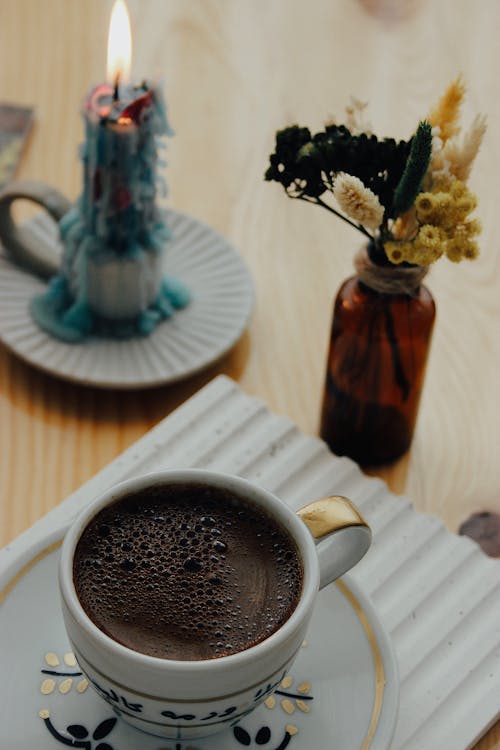 Cup of Coffee and a Candle 