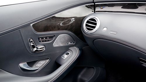 Free Close-up of a luxury car interior with sleek design and modern controls. Stock Photo