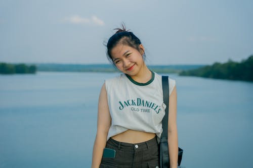 Young Woman Posing in front of Lake 