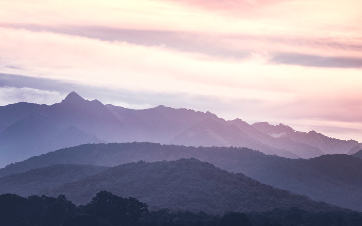 Scenic View Of Mountains During Dawn