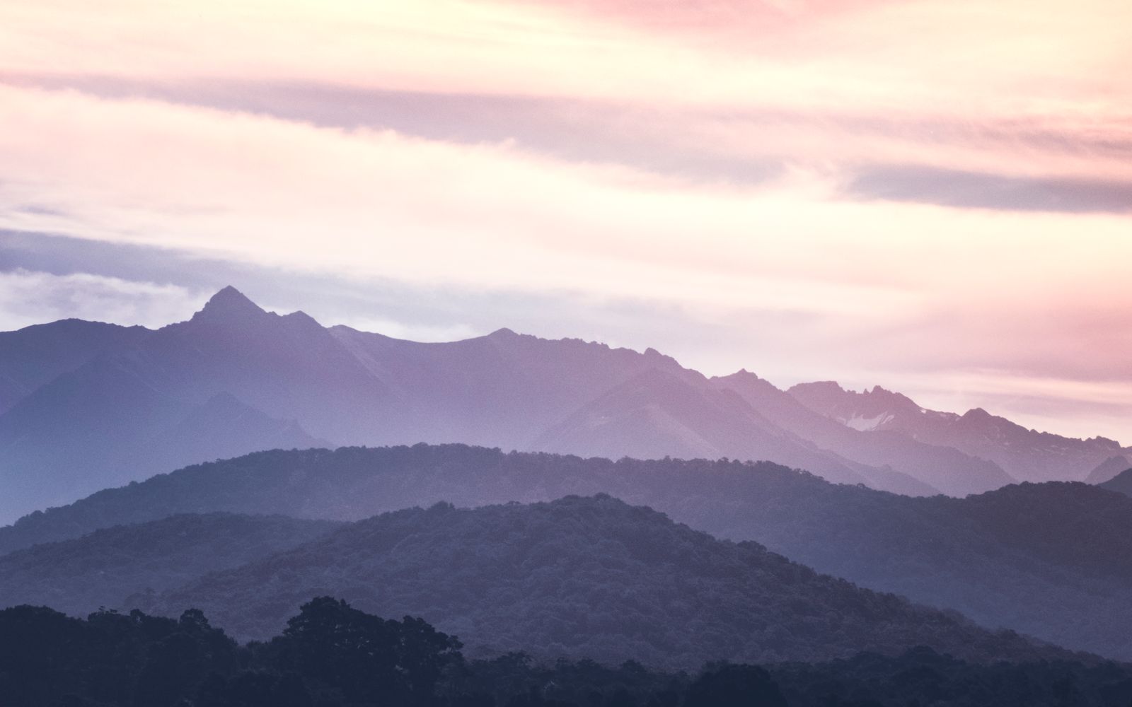 Mountain ridgelines at sunrise, photo by Tyler Lastovich on Pexels